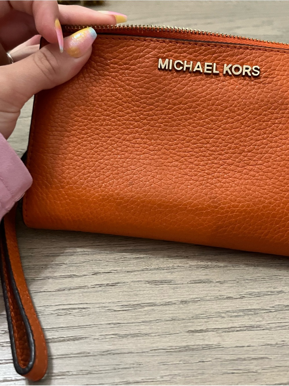 Michael Kors Orange Pebbled Leather Wristlet Clutch and phone holder